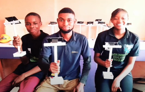 Students from African Child College in Nigeria with their solar lamps 