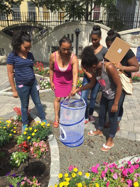 Figure 3. In New York City, “teen teachers” in the 4-H Exploring Your Urban Environment program guided younger children releasing butterflies as part of their environmental stewardship project. Credit: Teishawn W. Florestal-Kevelier.