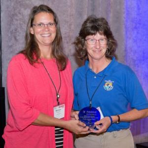 The Prairie Science Class Receives NAAEE's Award for Outstanding Service to EE by an Organization at the Regional Level at NAAEE's 2015 Annual Conference in San Diego, CA. 