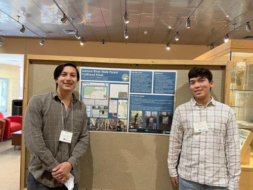 Michio Agresta and his teen mentee showcasing their community action project at the 2022 March conference.